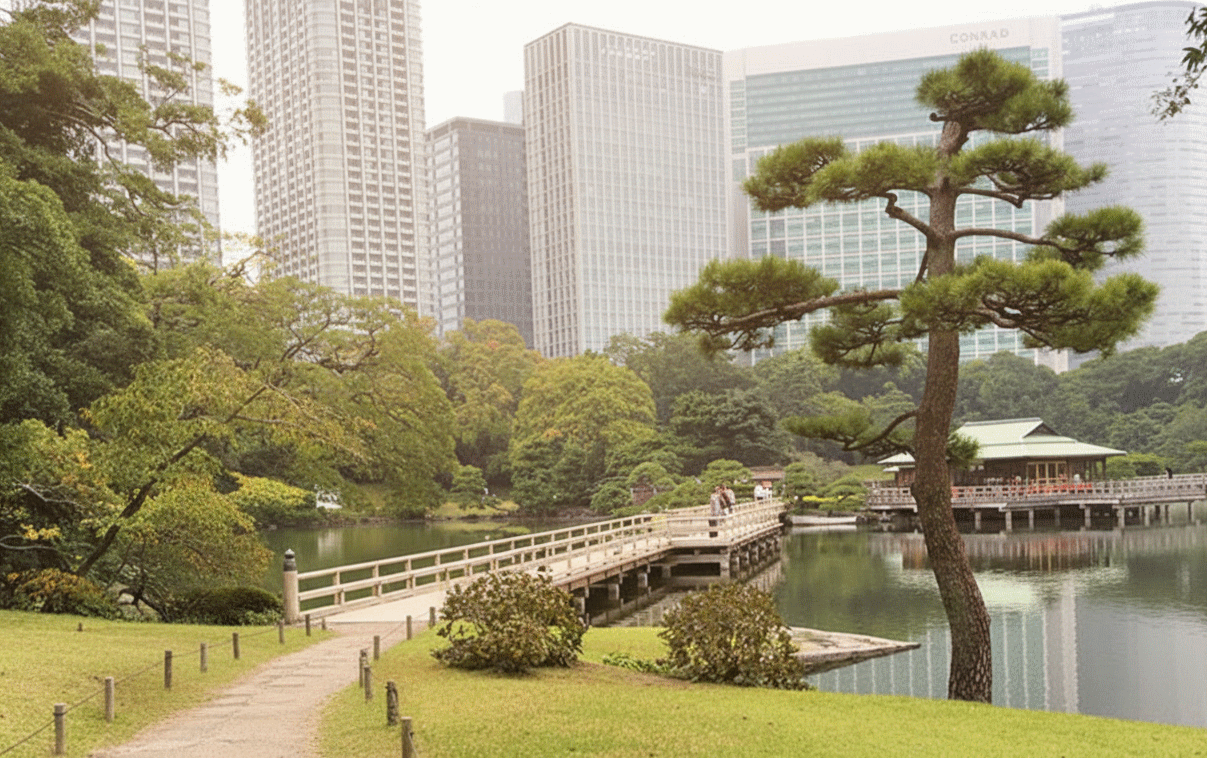 Hamarikyu Gardens Nakajima tea house floating on Shioiri pond with Tokyo skyline
